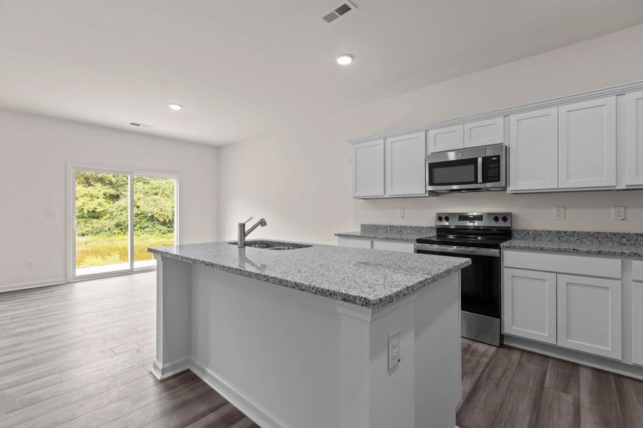 Representative furnished interior of a home built from the Hubble by Starlight Homes in Bayview, Conway (Image 10).