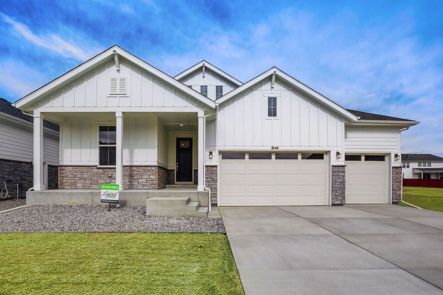 Front exterior of a new home in RainDance, Windsor, CO, highlighting curb appeal (Image 2).