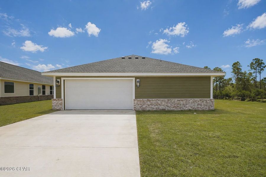 Front exterior of a new home in East Bay, Panama City, FL, highlighting curb appeal (Image 11). Front exterior of a new home in East Bay, Panama City, FL, highlighting curb appeal (Image 11).