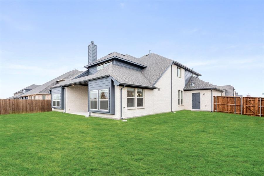 Exterior details and patio area of a home in Villages of Hurricane Creek, Anna (Image 23).