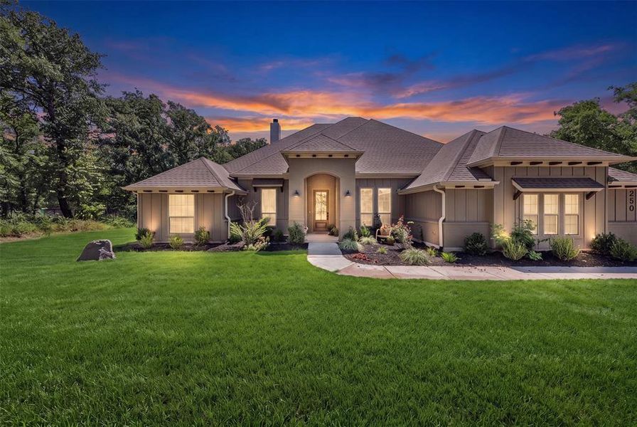 Front exterior of a new home in , Poolville, TX, highlighting curb appeal (Image 1). Front exterior of a new home in , Poolville, TX, highlighting curb appeal (Image 1).