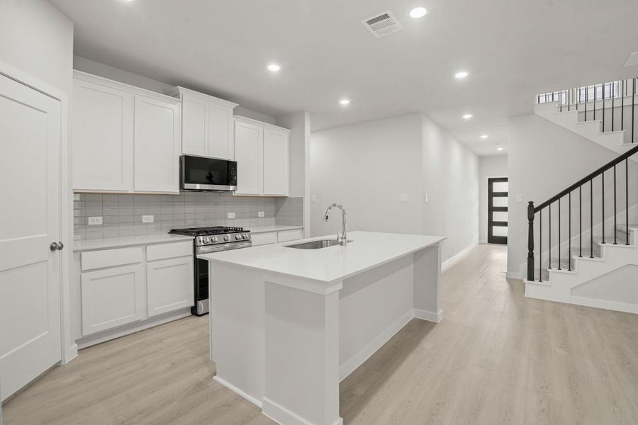 Furnished interior view inside a new home in Sunterra, Katy (Image 6).