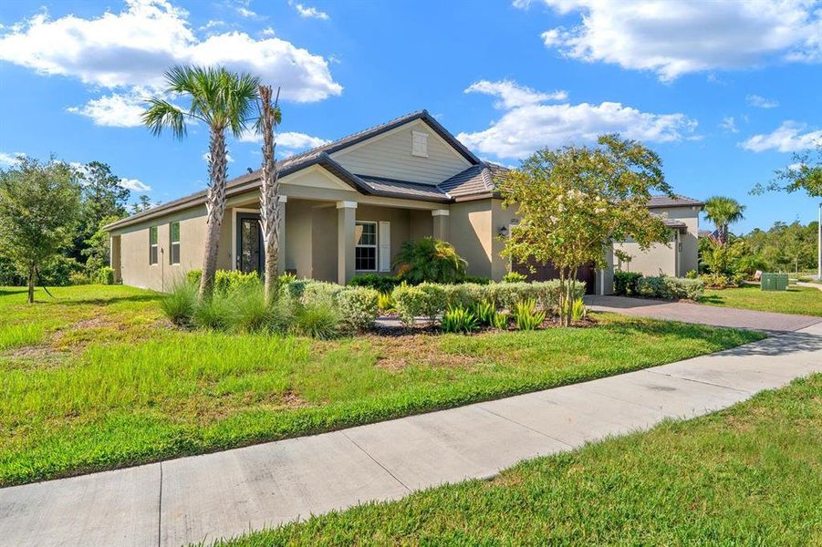 Front exterior of a new home in Angeline Active Adult, Land O' Lakes, FL, highlighting curb appeal (Image 21). Front exterior of a new home in Angeline Active Adult, Land O' Lakes, FL, highlighting curb appeal (Image 21).