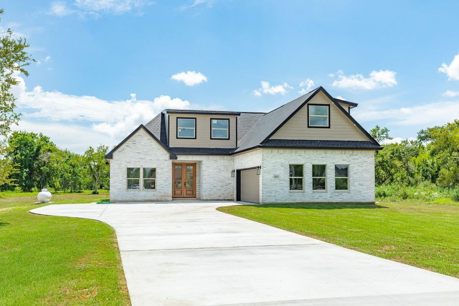 Front exterior of a new home in , Richwood, TX, highlighting curb appeal (Image 21).