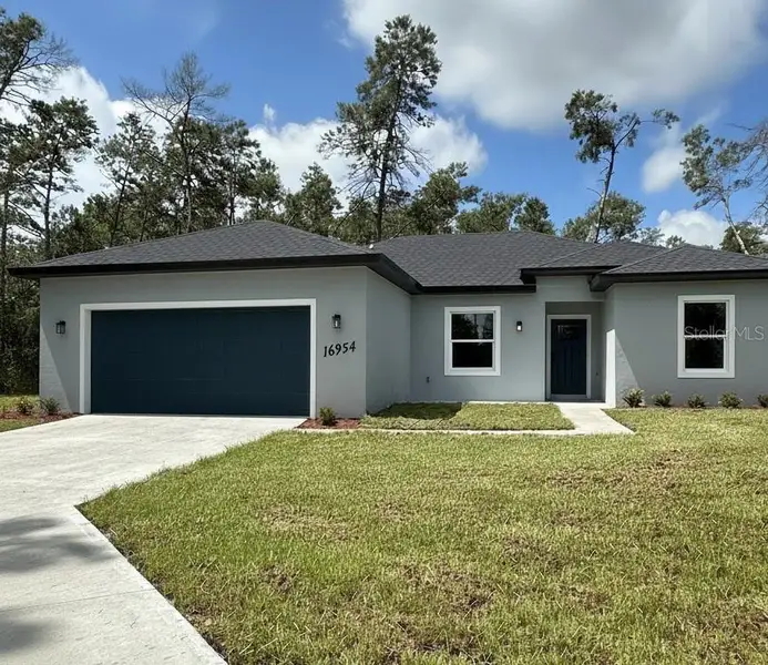 Front exterior of a new home in , Ocala, FL, highlighting curb appeal (Image 1).