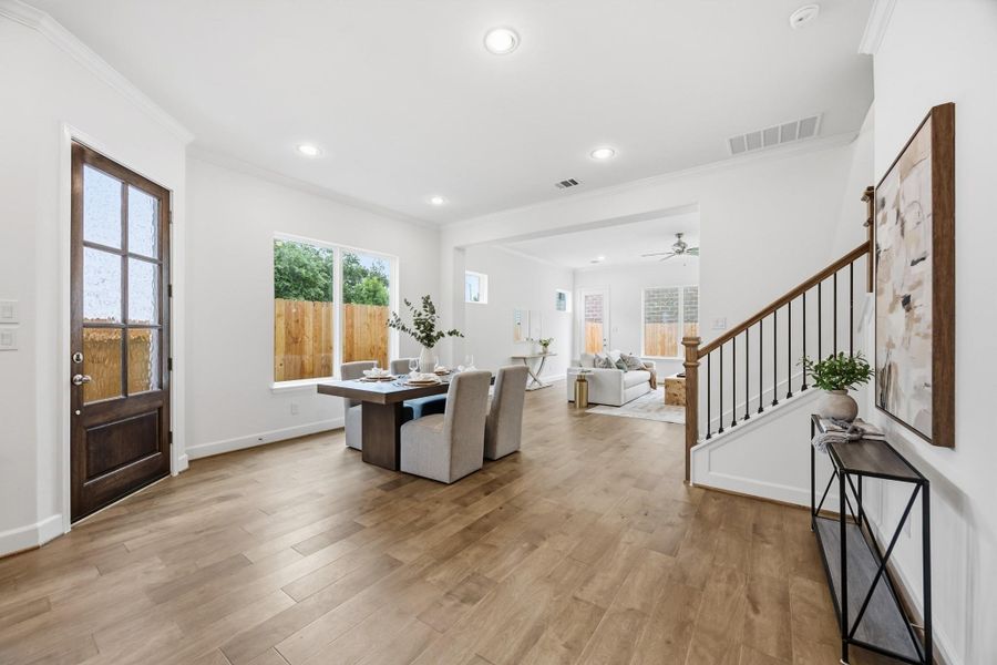 Central Sophistication: Right where family and friends converge, this dining room is the true heart of the home, bathed in welcoming natural light.