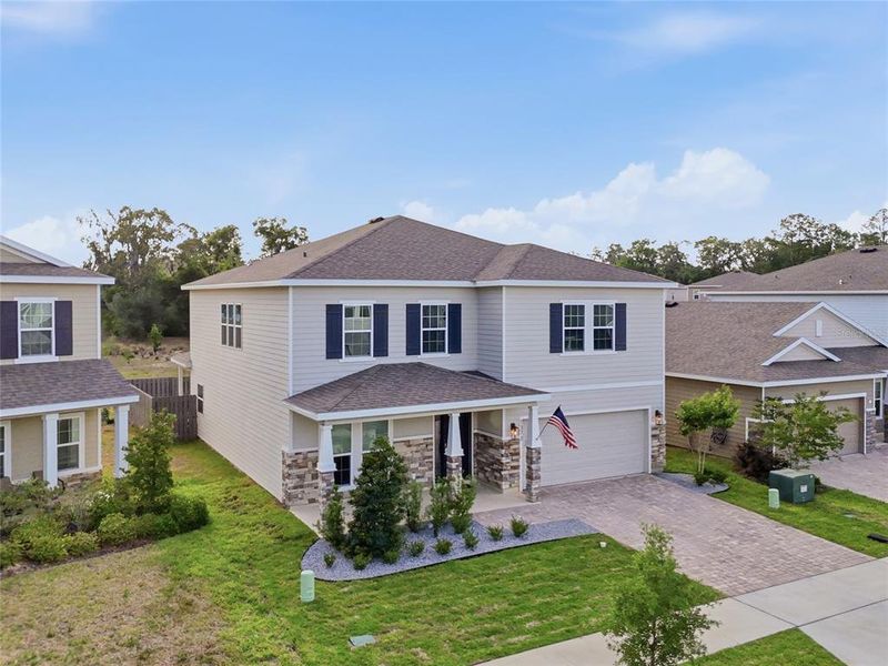 Front exterior of a new home in , Newberry, FL, highlighting curb appeal (Image 20).
