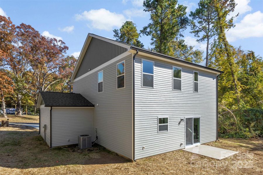 Front exterior of a new home in , Huntersville, NC, highlighting curb appeal (Image 1).