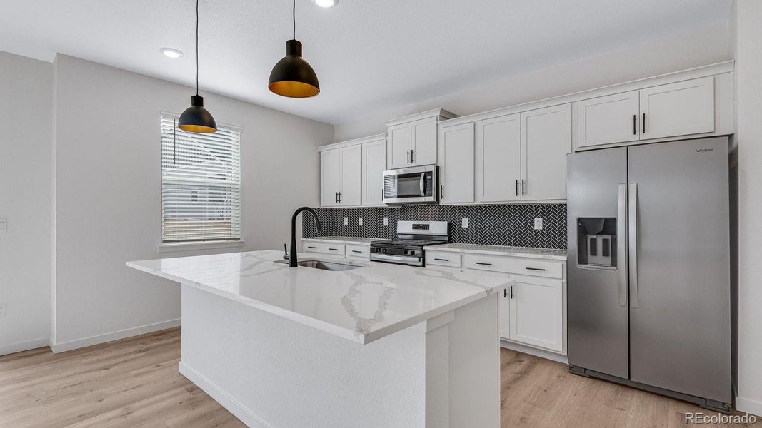 Furnished interior view inside a new home in Trails at Crowfoot, Parker (Image 4).