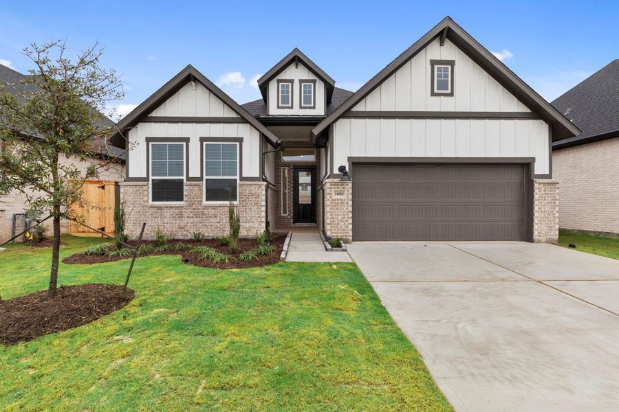 Front exterior of a new home in Blue Heron, Mont Belvieu, TX, highlighting curb appeal (Image 22).