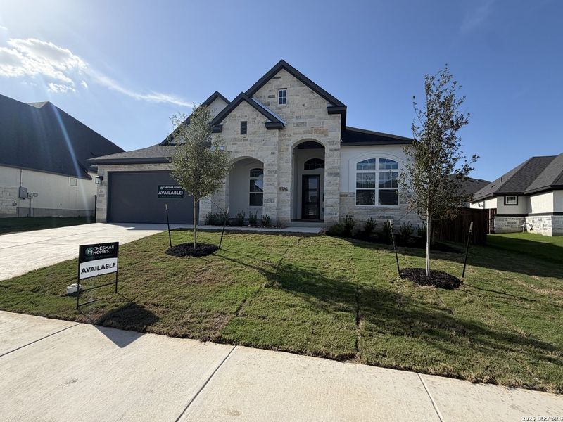 Front exterior of a new home in Mesa Western, Cibolo, TX, highlighting curb appeal (Image 14). Front exterior of a new home in Mesa Western, Cibolo, TX, highlighting curb appeal (Image 14).