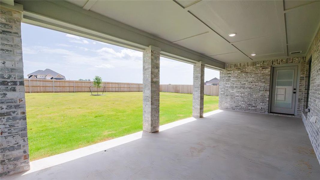 Fenced backyard with a patio Fenced backyard with a patio