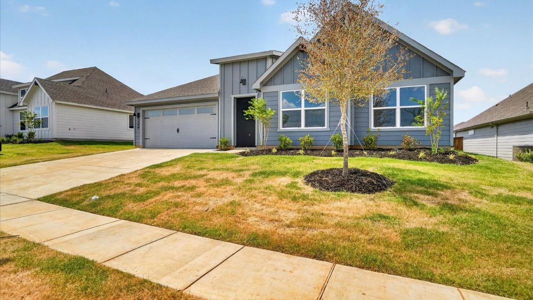 Front exterior of a new home in Sandstone Estates, Granbury, TX, highlighting curb appeal (Image 17).