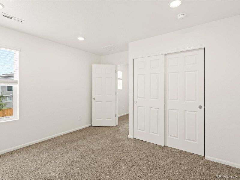 Spacious, unfurnished interior of a new home in Ridgeline Vista: The Flora Collection, Brighton (Image 17).