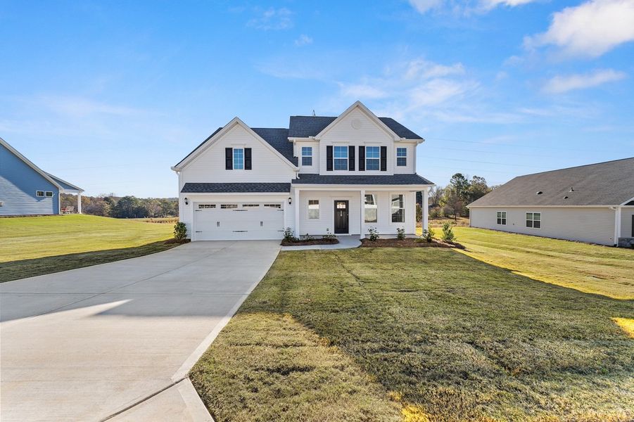 Front exterior of a new home in Foxhall Landing, Easley, SC, highlighting curb appeal (Image 1).
