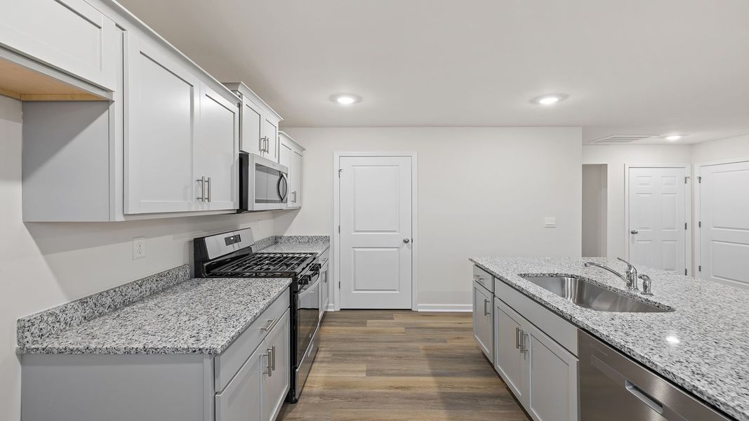 Furnished interior view inside a new home in Bentley Park, Greenwood (Image 9).