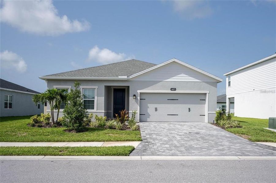 Front exterior of a new home in , Port Charlotte, FL, highlighting curb appeal (Image 22). Front exterior of a new home in , Port Charlotte, FL, highlighting curb appeal (Image 22).