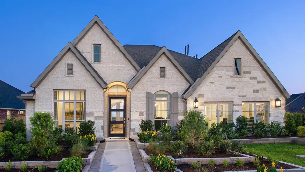Front exterior of a new home in The Woodlands Hills, Willis, TX, highlighting curb appeal (Image 2). Front exterior of a new home in The Woodlands Hills, Willis, TX, highlighting curb appeal (Image 2).