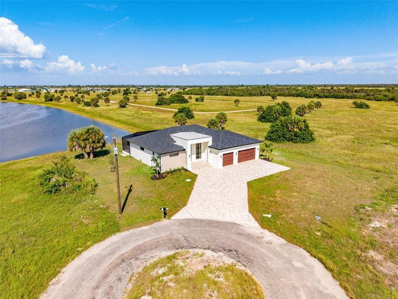 Front exterior of a new home in , Placida, FL, highlighting curb appeal (Image 31).