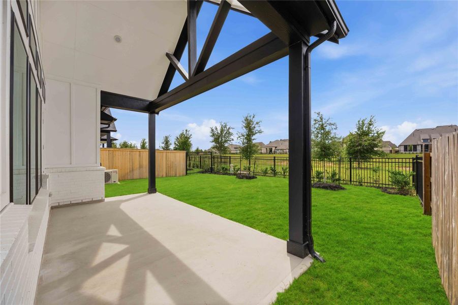 Exterior details and patio area of a home in Elyson, Katy (Image 2). Exterior details and patio area of a home in Elyson, Katy (Image 2).