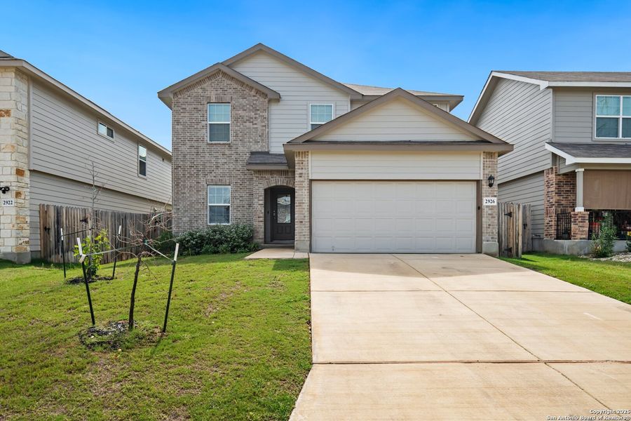 Front exterior of a new home in Laurel Vistas, San Antonio, TX, highlighting curb appeal (Image 20).