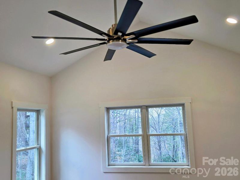 Primary bedroom with ve large ceiling fan