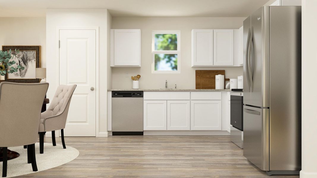 A kitchen with white cabinets. A kitchen with white cabinets.
