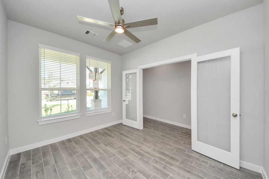 Take a look at the beautiful home office, located at the forefront of the home. Sample photo of completed home with similar floor plan. Actual colors and selections may vary. Take a look at the beautiful home office, located at the forefront of the home. Sample photo of completed home with similar floor plan. Actual colors and selections may vary.