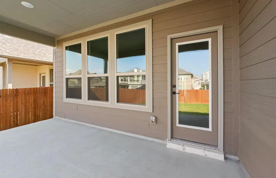 Exterior details and patio area of a home in Saddleback at Santa Rita Ranch, Liberty Hill (Image 7).