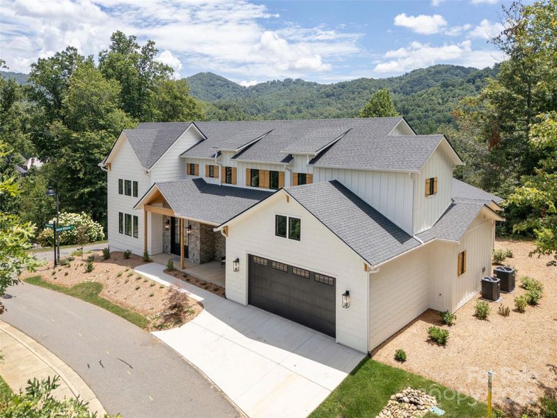 Front exterior of a new home in , Asheville, NC, highlighting curb appeal (Image 24).