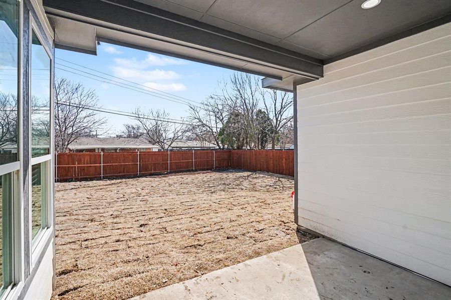 Covered back patio is perfect for your furnishings and enjoying evenings together!