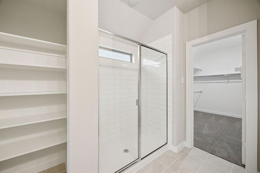 Primary Bathroom in the Oscar home plan by Trophy Signature Homes – REPRESENTATIVE PHOTO