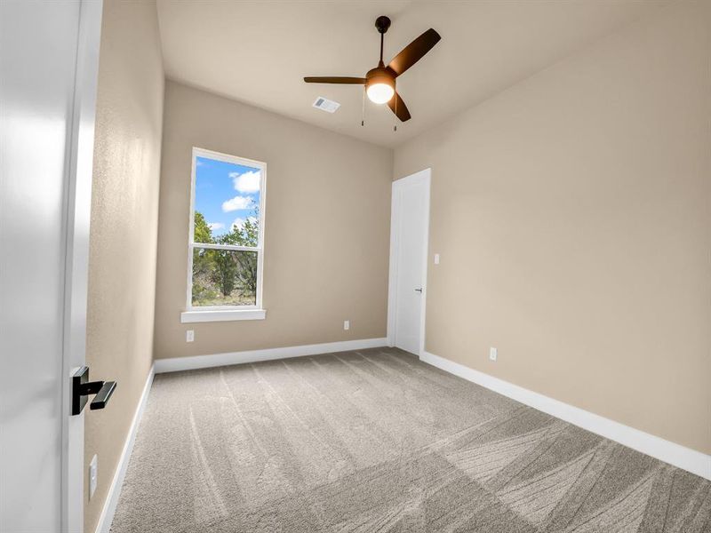 Unfurnished room with carpet and ceiling fan