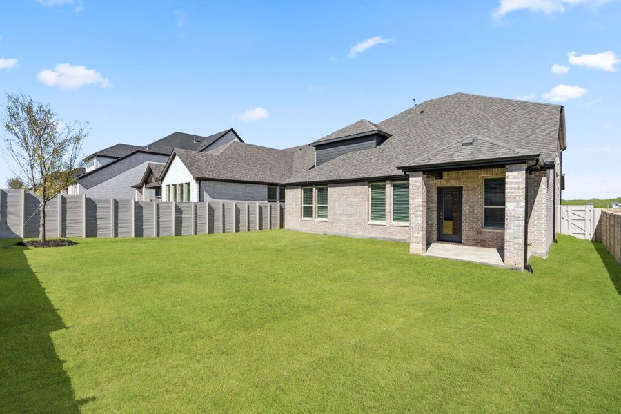 Exterior details and patio area of a home in Painted Tree Woodland West, McKinney (Image 23).