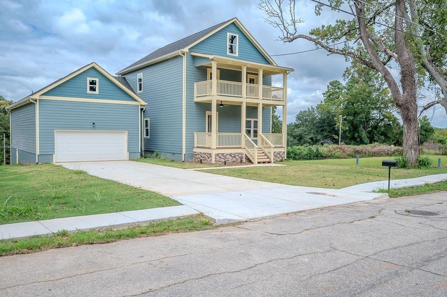 Front exterior of a new home in , Atlanta, GA, highlighting curb appeal (Image 1).