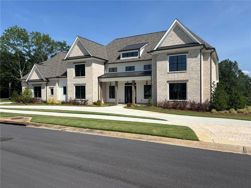 Front exterior of a new home in The Georgia Club, Statham, GA, highlighting curb appeal (Image 2).