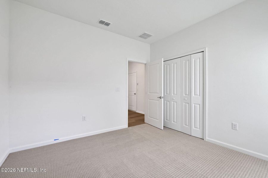 Spacious, unfurnished interior of a new home in TrailMark, St. Augustine (Image 21).