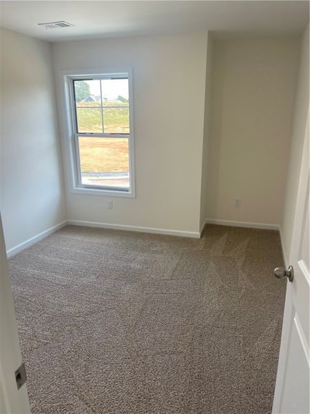 Spacious, unfurnished interior of a new home in Springwood Grove, Central (Image 20).