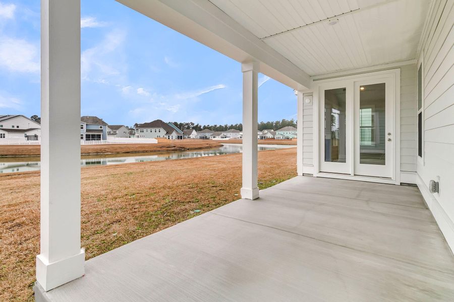 Exterior details and patio area of a home in Tidewater at Lakes of Cane Bay, Summerville (Image 3).