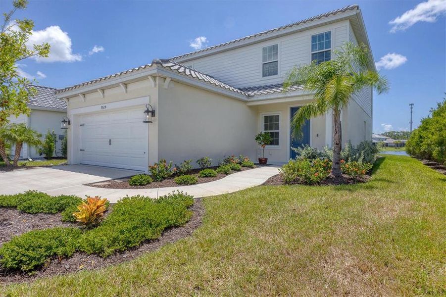 Front exterior of a new home in , Sarasota, FL, highlighting curb appeal (Image 1). Front exterior of a new home in , Sarasota, FL, highlighting curb appeal (Image 1).