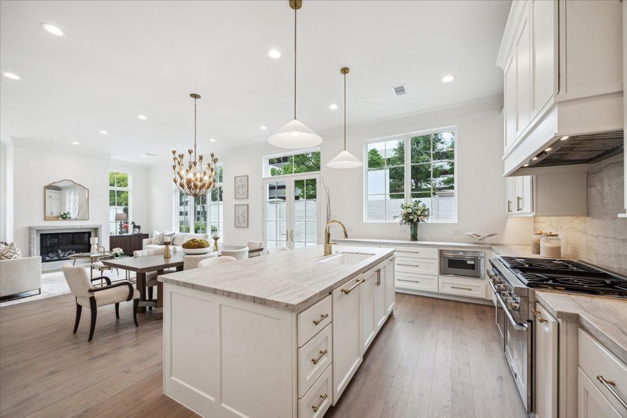 Oversized island and undermount Porcelain sink with Kallista faucet will complete this luxury kitchen. Ample prep space, storage space, and island seating make this space functional and stunning. **Photo is of another home in the community and for information purposes only. Buyer to verify all details.** Oversized island and undermount Porcelain sink with Kallista faucet will complete this luxury kitchen. Ample prep space, storage space, and island seating make this space functional and stunning. **Photo is of another home in the community and for information purposes only. Buyer to verify all details.**
