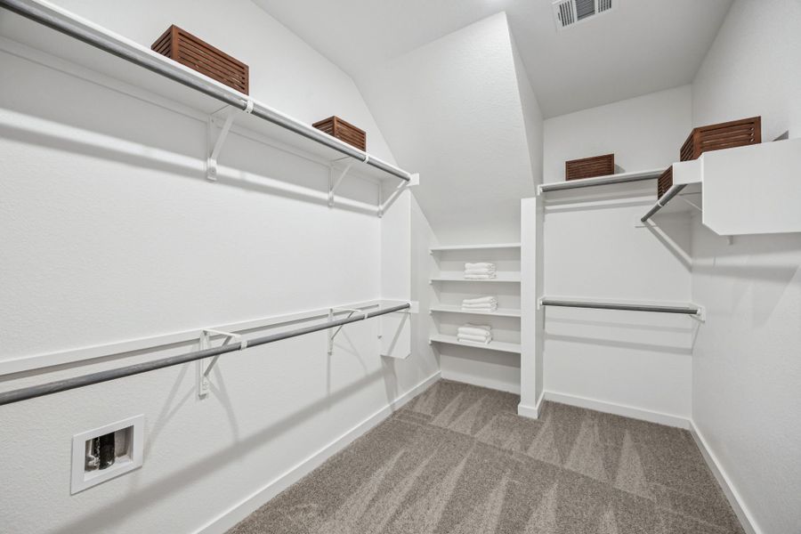 Primary Closet in the Trinity home plan by Trophy Signature Homes – REPRESENTATIVE PHOTO