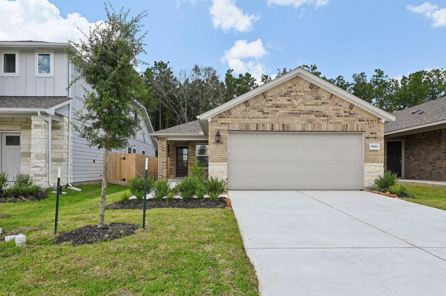 Front exterior of a new home in , New Caney, TX, highlighting curb appeal (Image 2). Front exterior of a new home in , New Caney, TX, highlighting curb appeal (Image 2).