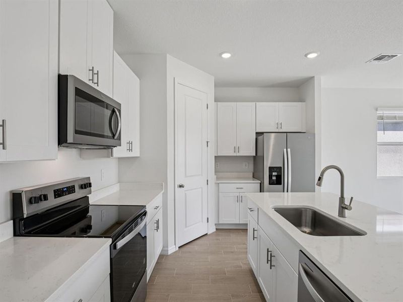 Furnished interior view inside a new home in Coasterra - Reserve Series, Palmetto (Image 13).