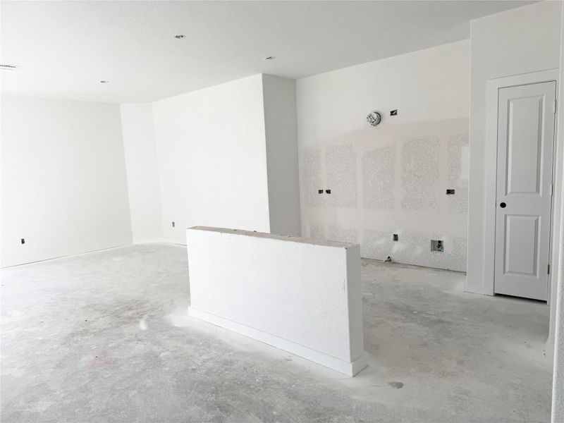 Spare room featuring unfinished concrete flooring Spare room featuring unfinished concrete flooring