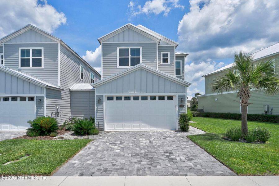 Front exterior of a new home in , St. Johns, FL, highlighting curb appeal (Image 2). Front exterior of a new home in , St. Johns, FL, highlighting curb appeal (Image 2).