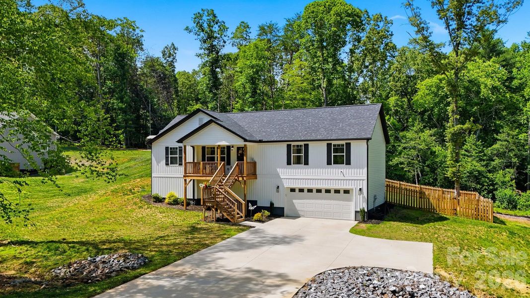 Front exterior of a new home in , Granite Falls, NC, highlighting curb appeal (Image 1). Front exterior of a new home in , Granite Falls, NC, highlighting curb appeal (Image 1).