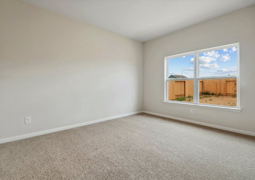 Master bedroom with a large window Master bedroom with a large window