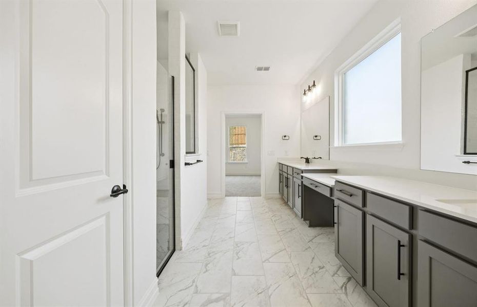 Owner's private bath with double vanity