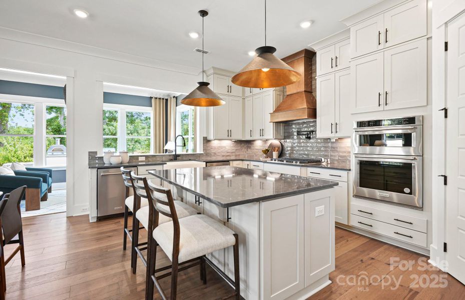 Spacious Island with Storage on Both Sides of the Island and Additional Seating Space.  Representative Photo.